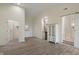Living space showing a kitchenette, white trim, and a sliding door to the bathroom at 6348 W 750 N, McCordsville, IN 46055