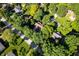 Aerial view of a neighborhood showcasing mature trees and residences in a well-established community at 6575 Robin Hood Dr, Indianapolis, IN 46227