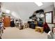 Finished attic space with storage, seating, and natural light from window at 6575 Robin Hood Dr, Indianapolis, IN 46227