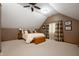 Cozy bedroom features a comfortable bed, neutral carpet and trim, and decorative window treatments at 6575 Robin Hood Dr, Indianapolis, IN 46227