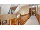 Bright hallway featuring a chandelier, wooden banister, and entryway view at 6575 Robin Hood Dr, Indianapolis, IN 46227