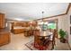Well-appointed kitchen featuring wood cabinets, tiled floors, and a breakfast bar at 6575 Robin Hood Dr, Indianapolis, IN 46227