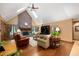 Cozy living room with a fireplace, hardwood floors, and vaulted ceilings at 6575 Robin Hood Dr, Indianapolis, IN 46227