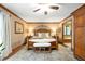 Spacious main bedroom with decorative rug, ceiling fan, and an en-suite bathroom with tub at 6575 Robin Hood Dr, Indianapolis, IN 46227