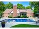 Backyard swimming pool and patio area with lush landscaping at 6575 Robin Hood Dr, Indianapolis, IN 46227