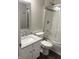 Bathroom showcasing a modern vanity, tiled shower, and stylish mirror at 6604 Heritage Hill Dr, Indianapolis, IN 46237