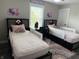 Bright bedroom with twin beds, custom wall art, and playful decor at 6604 Heritage Hill Dr, Indianapolis, IN 46237