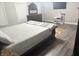 Well-lit bedroom with a large bed, dresser, and a nice view at 6604 Heritage Hill Dr, Indianapolis, IN 46237