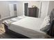 Bright bedroom features a bed, a dresser, and two nightstands at 6604 Heritage Hill Dr, Indianapolis, IN 46237