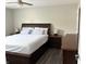Comfortable bedroom with dark wood furniture and a ceiling fan at 6604 Heritage Hill Dr, Indianapolis, IN 46237