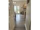 Open kitchen and dining area with wood floors and access to the backyard through glass sliding doors at 6604 Heritage Hill Dr, Indianapolis, IN 46237