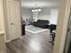 Open-concept living room features wood-look floors and a decorative blue patterned rug at 6604 Heritage Hill Dr, Indianapolis, IN 46237