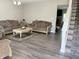 Spacious living room with hardwood floors, plush sofas, and a cozy atmosphere at 6604 Heritage Hill Dr, Indianapolis, IN 46237