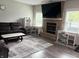 Bright living room featuring a fireplace, hardwood floors, and dedicated workspace at 6604 Heritage Hill Dr, Indianapolis, IN 46237