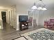The playroom is bathed in natural light, has wood-look floors and houses a doll house at 6604 Heritage Hill Dr, Indianapolis, IN 46237