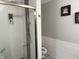 Bathroom featuring a white textured tile shower with black accent at 6604 Heritage Hill Dr, Indianapolis, IN 46237