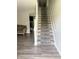 Elegant staircase with a patterned carpet runner and hardwood flooring at 6604 Heritage Hill Dr, Indianapolis, IN 46237
