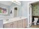 Well-appointed bathroom with double sink vanity, large mirror, and separate toilet room at 6897 Abercon Trl, Noblesville, IN 46062