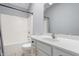 Bathroom featuring a shower-tub combo and a vanity with gold pulls at 6897 Abercon Trl, Noblesville, IN 46062