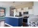 Well-designed kitchen with stainless steel appliances, white cabinetry, and a stylish island with a breakfast bar at 6897 Abercon Trl, Noblesville, IN 46062