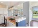 Modern kitchen showcasing stainless steel appliances, white cabinets, and a convenient breakfast bar area at 6897 Abercon Trl, Noblesville, IN 46062