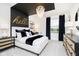 Chic bedroom featuring a black and gold color scheme, a stylish chandelier, and modern furniture at 7242 Barrett Dr, Brownsburg, IN 46112