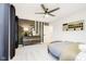 Stylish bedroom featuring a decorative accent wall, ceiling fan, and modern furnishings at 7242 Barrett Dr, Brownsburg, IN 46112