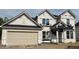 An exterior shot of a new home construction with a two-car garage and unfinished exterior at 7242 Barrett Dr, Brownsburg, IN 46112