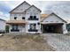 Exterior construction of a two-story home with a two car garage and bright natural light at 7242 Barrett Dr, Brownsburg, IN 46112