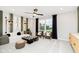 Cozy living room with modern decor, a striking chess set, comfortable seating, and a large window at 7242 Barrett Dr, Brownsburg, IN 46112
