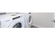 Bright laundry area showcasing a side-by-side, front-load washer and dryer at 7318 Shroyer Way, Noblesville, IN 46062