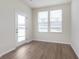 Bright living room with large windows, hard surface floors and neutral wall paint at 7318 Shroyer Way, Noblesville, IN 46062