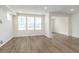 Bright living room with large windows, hard surface floors and neutral wall paint at 7318 Shroyer Way, Noblesville, IN 46062