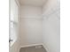 Bright walk-in closet with white wire shelving, neutral paint, and carpet at 7318 Shroyer Way, Noblesville, IN 46062