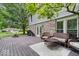 An outdoor deck with seating area, dining table, and grill offer a relaxing outdoor experience at 7345 Monon Cir, Indianapolis, IN 46256