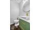 Stylish powder room featuring geometric wallpaper, modern sink, and gold fixtures at 7345 Monon Cir, Indianapolis, IN 46256