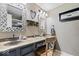 Bathroom featuring double sinks, decorative mirrors, and a decorative chair at 7345 Monon Cir, Indianapolis, IN 46256