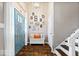 Welcoming entryway features tile floors, a bench, and decorative wall art at 7345 Monon Cir, Indianapolis, IN 46256