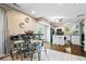 Open kitchen and bar area featuring modern fixtures, and stainless appliances at 7345 Monon Cir, Indianapolis, IN 46256