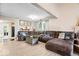 Open-concept living room with a large sectional sofa, connecting to the kitchen area at 7345 Monon Cir, Indianapolis, IN 46256