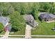 Charming single-story home with an attached two-car garage and well-manicured landscaping and a large lawn at 7421 Meadow Violet Ct, Avon, IN 46123