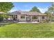 Beautiful backyard with a large deck, patio, and lush lawn at 7421 Meadow Violet Ct, Avon, IN 46123