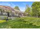 Expansive backyard featuring a large deck and manicured lawn at 7421 Meadow Violet Ct, Avon, IN 46123
