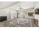 Spacious basement living area with sleek furnishings and modern ceiling fan at 7421 Meadow Violet Ct, Avon, IN 46123