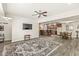 Wide view of open basement with living area, dining area, and bar seating at 7421 Meadow Violet Ct, Avon, IN 46123