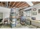 Basement workspace with storage shelves, a desk, and a window for natural light at 7421 Meadow Violet Ct, Avon, IN 46123