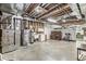 Exposed basement featuring a furnace, water heater, and visible pipes on an unfinished ceiling at 7421 Meadow Violet Ct, Avon, IN 46123