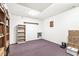 Basement area with a bookshelf, boxes, and carpeted floors, offering ample storage space at 7421 Meadow Violet Ct, Avon, IN 46123