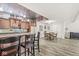 Basement bar area with seating, wood cabinets, and unique decor at 7421 Meadow Violet Ct, Avon, IN 46123