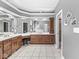 Spacious bathroom featuring double vanity, wood cabinets, and stylish mirrors at 7421 Meadow Violet Ct, Avon, IN 46123